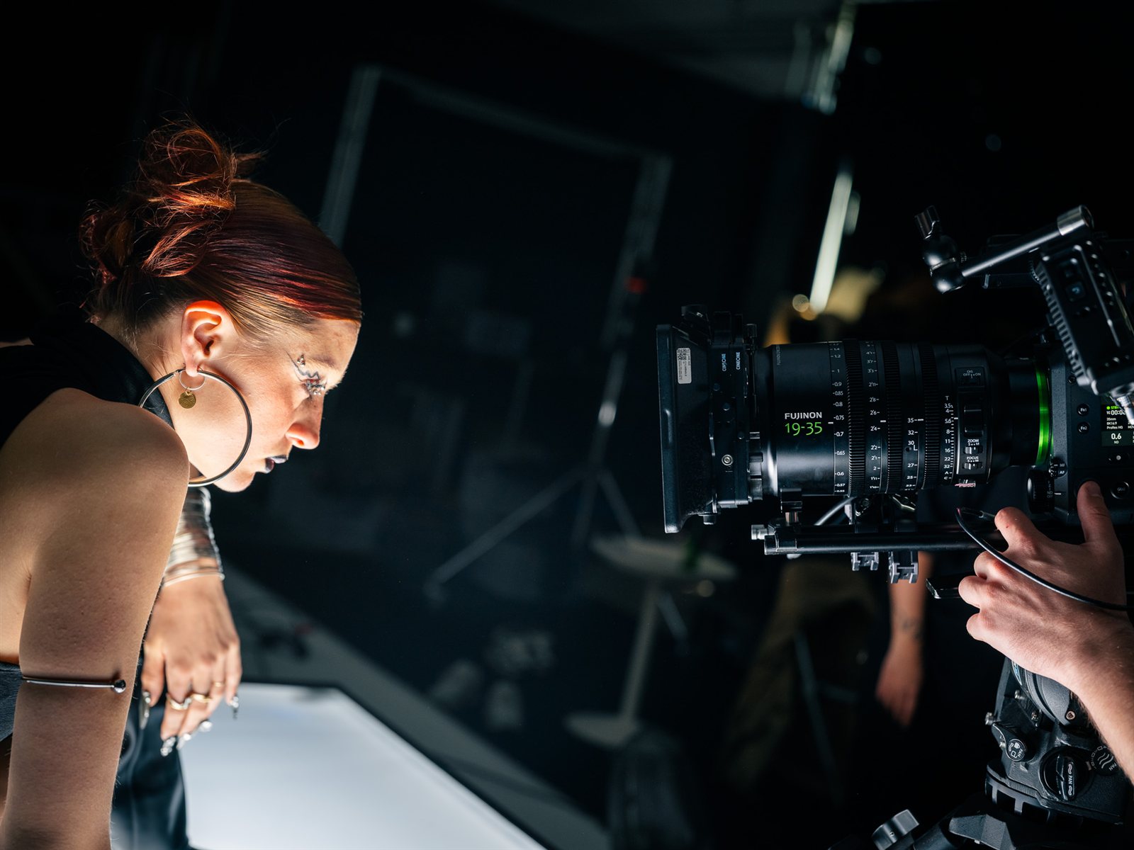 The FUJINON GF19-35 up close as the artist leans over a lightbox