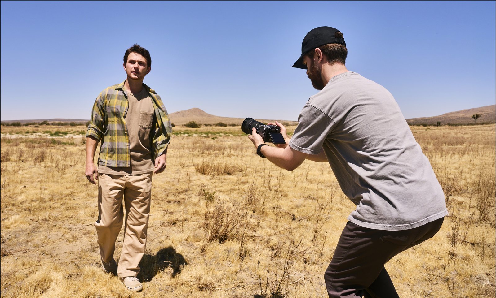 Operator filming handheld with the FX5 in open desert